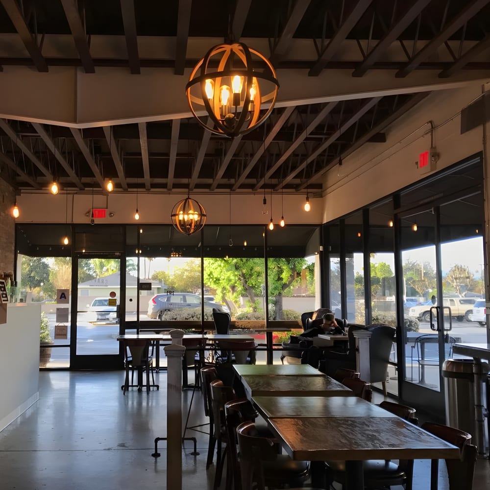 Sunlit dining room inside a Crave Coffee & Tea cafe